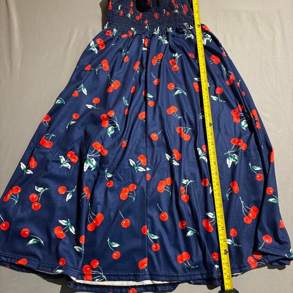 Navy blue cherry print dress with red cherries and green stems pinup